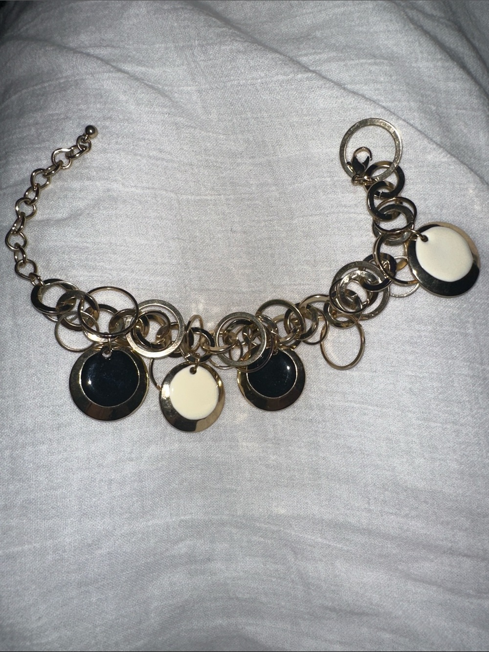 Gold Tone Circle Link Charm Bracelet with Black and Cream Discs